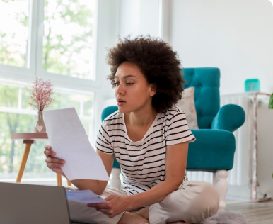 Person reviewing their finances and credit documents